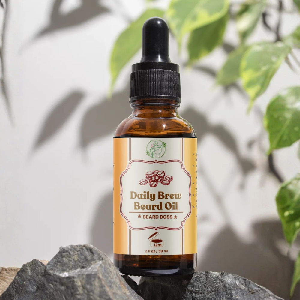 Bottle of 'Daily Brew Beard Oil' by Beard Boss on a rock with leaves in the background